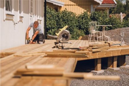 working on a wooden deck buildfix repairs llc